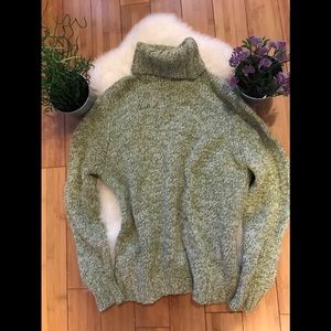 Sisley green turtleneck.